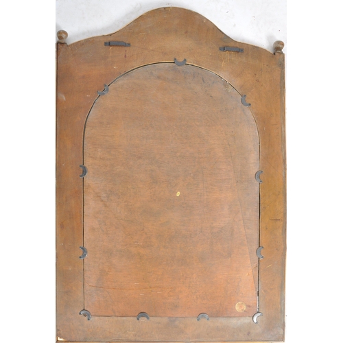 43 - A vintage early 20th Century bamboo and cane wall hanging mirror having a single shaped mirror plate... 