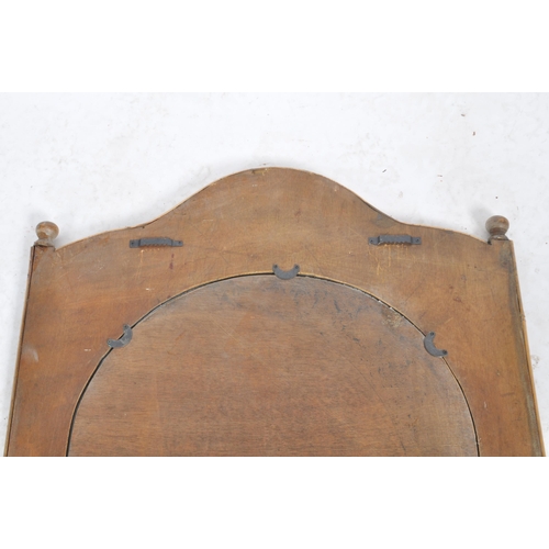 43 - A vintage early 20th Century bamboo and cane wall hanging mirror having a single shaped mirror plate... 