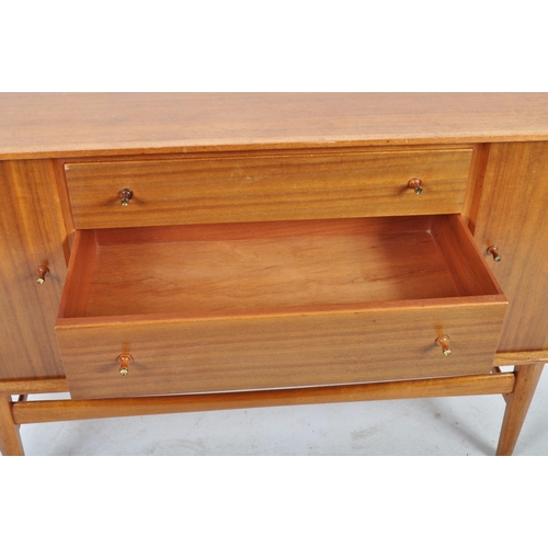 435 - Gordon Russell - A retro mid 20th Century teak sideboard credenza having a central bank of three dra... 