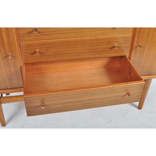 435 - Gordon Russell - A retro mid 20th Century teak sideboard credenza having a central bank of three dra... 