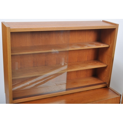 454 - British Modern Furniture – A mid 20th Century teak wood modular cabinet / wall unit having twin door... 