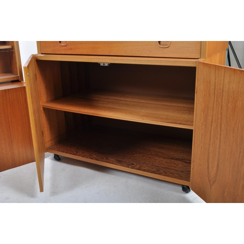 454 - British Modern Furniture – A mid 20th Century teak wood modular cabinet / wall unit having twin door... 