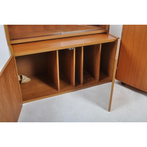 454 - British Modern Furniture – A mid 20th Century teak wood modular cabinet / wall unit having twin door... 