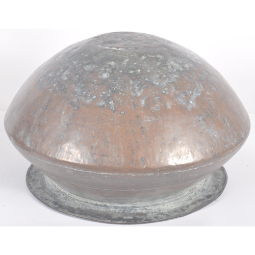 462 - An 18th Century Indonesian copper serving pot of bulbous circular form having a flat circular rim ov... 