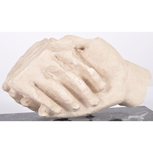 469 - A contemporary cast resin sculpture ornament of a pair of shaking hands cut off from the wrist. Supp... 