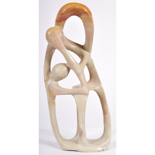 473 - A retro 20th Century carved soapstone abstract figure group sculpture depicting interwoven figures. ... 