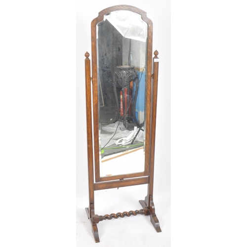 482 - An early 20th Century full length oak cheval dressing mirror having a single bevelled edge mirror pl... 