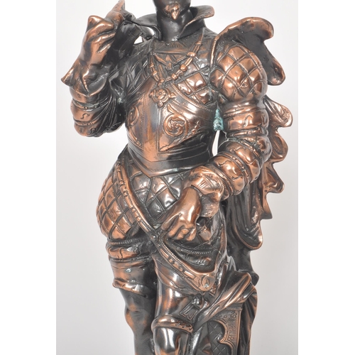 487 - A retro vintage 20th Century copper effect figure of medieval soldier in full armour raised on a dec... 