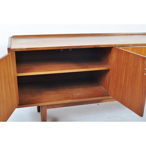 50 - A large mid 20th Century Danish influenced teak wood sideboard credenza having a dual bank of eight ... 