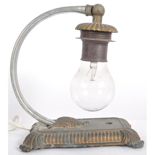 537 - A vintage 20th Century cast iron arc table / desk lamp light having a hanging bulb via and arched ar... 