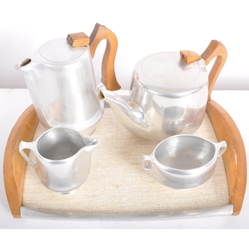 559 - A mid 20th Century 1950s Picquot Ware Danish inspired metal tea and coffee service comprising of tea... 