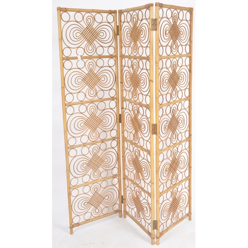 56 - A retro mid 20th Century bamboo and cane three section room divider screen having worked bamboo pane... 