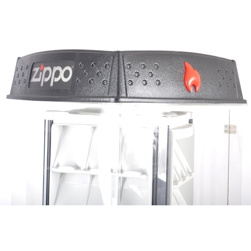 563 - An original late 20th Century Zippo Lighters shop display revolving display cabinet. Comprises an cl... 