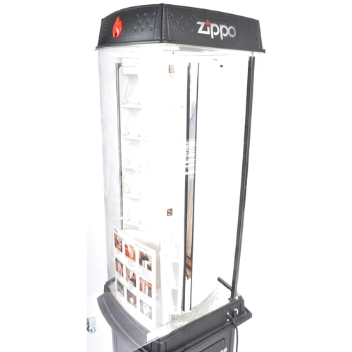 563 - An original late 20th Century Zippo Lighters shop display revolving display cabinet. Comprises an cl... 