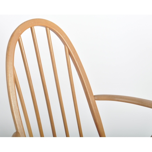 570 - Lucian Ercolani for Ercol Furniture - A retro 20th Century beech and elm wood rocking chair / armcha... 