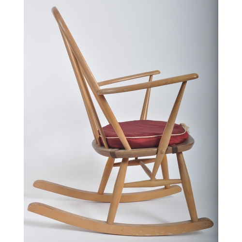 570 - Lucian Ercolani for Ercol Furniture - A retro 20th Century beech and elm wood rocking chair / armcha... 