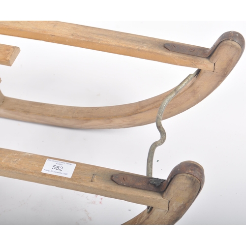 582 - A vintage retro 20th century Davos (Germany) wooden sleigh / toboggan with metal runners. Slatted to... 