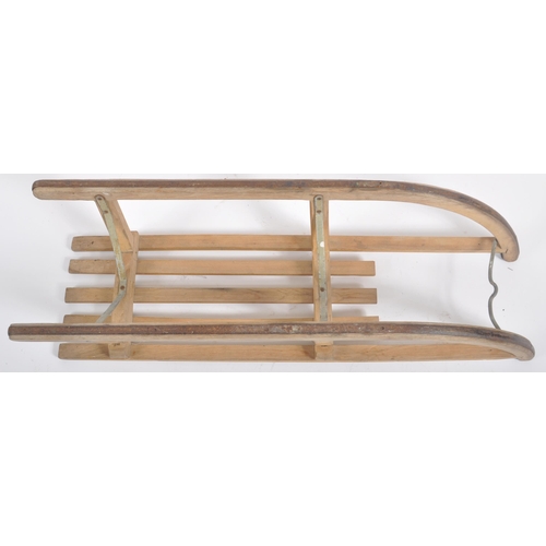 582 - A vintage retro 20th century Davos (Germany) wooden sleigh / toboggan with metal runners. Slatted to... 