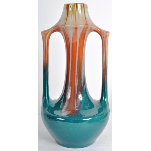 583 - A selection of retro 20th Century studio pottery vases of Art Nouveau influence having drip glazed d... 