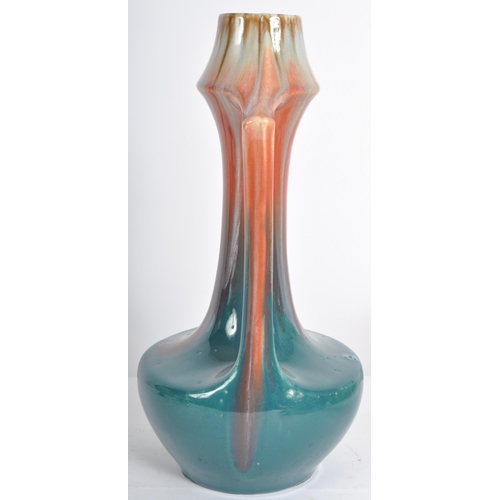 583 - A selection of retro 20th Century studio pottery vases of Art Nouveau influence having drip glazed d... 