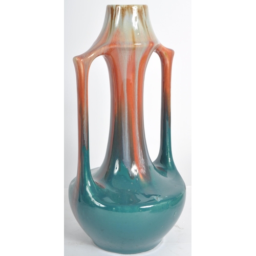 583 - A selection of retro 20th Century studio pottery vases of Art Nouveau influence having drip glazed d... 