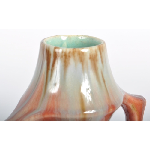 583 - A selection of retro 20th Century studio pottery vases of Art Nouveau influence having drip glazed d... 