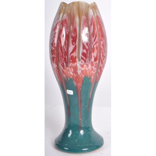 583 - A selection of retro 20th Century studio pottery vases of Art Nouveau influence having drip glazed d... 