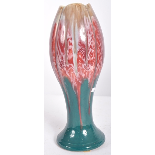 583 - A selection of retro 20th Century studio pottery vases of Art Nouveau influence having drip glazed d... 