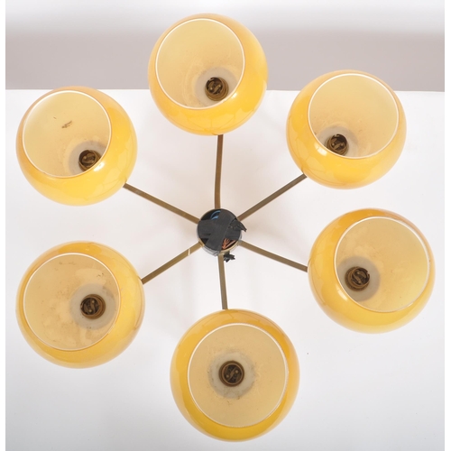 594 - A retro mid 20th Century six branch hanging ceiling light chandelier of brass construction with each... 