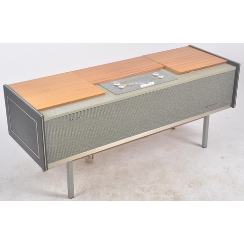 667 - Argosy - A retro mid 20th Century free standing stereogram / radio credenza having a teak and metal ... 