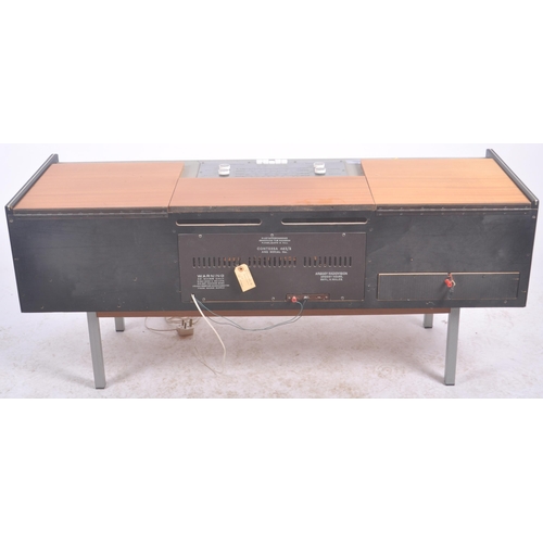 667 - Argosy - A retro mid 20th Century free standing stereogram / radio credenza having a teak and metal ... 