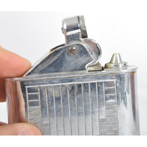 67 - Floating Lighter - An early 20th Century French Art Deco chromed brass lighter having engine turned ... 