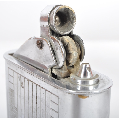 67 - Floating Lighter - An early 20th Century French Art Deco chromed brass lighter having engine turned ... 