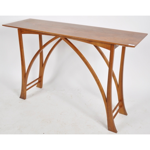 68 - Henry Swanzy - A contemporary Arts and Crafts style designer walnut console hall table having an elo... 