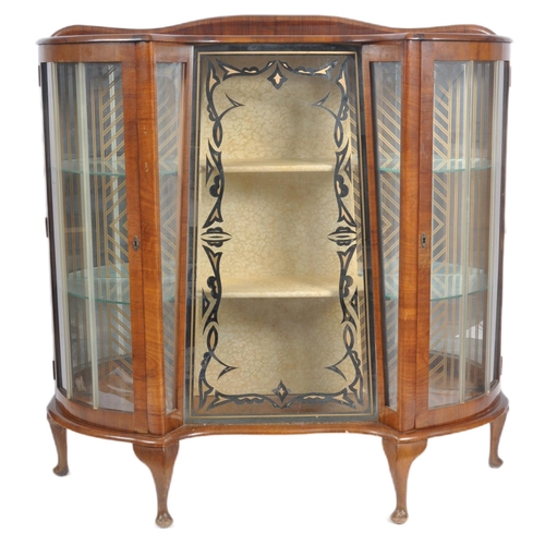 78 - A vintage 20th Century Art Deco walnut breakfront display cabinet vitrine having bowed glass doors t... 