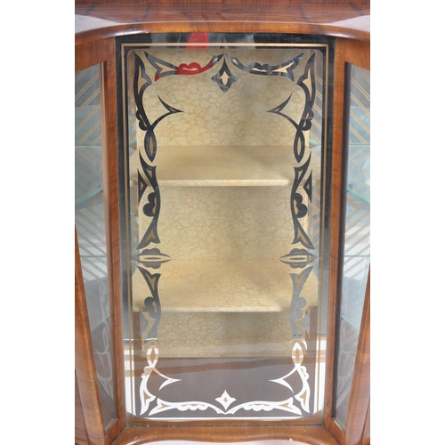 78 - A vintage 20th Century Art Deco walnut breakfront display cabinet vitrine having bowed glass doors t... 