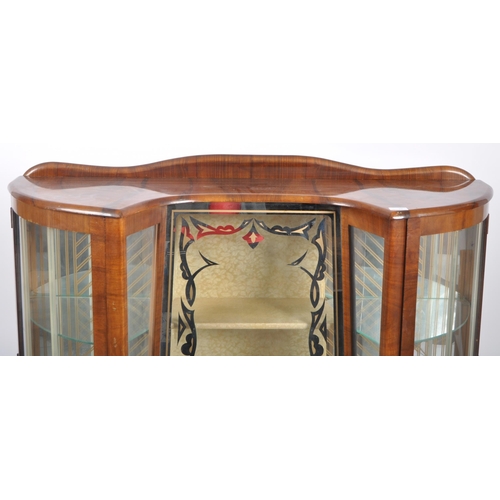 78 - A vintage 20th Century Art Deco walnut breakfront display cabinet vitrine having bowed glass doors t... 