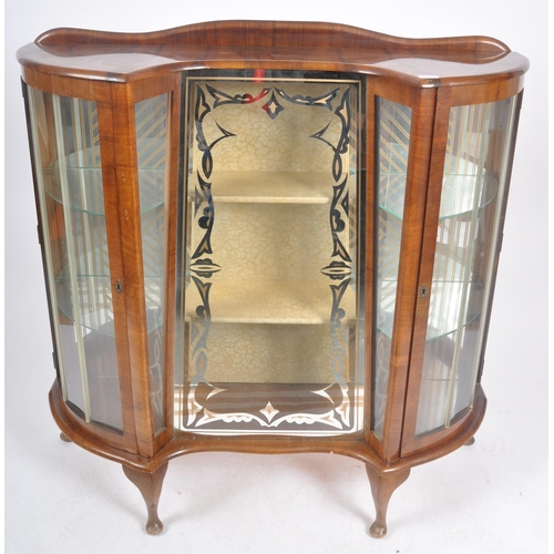 78 - A vintage 20th Century Art Deco walnut breakfront display cabinet vitrine having bowed glass doors t... 