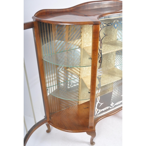 78 - A vintage 20th Century Art Deco walnut breakfront display cabinet vitrine having bowed glass doors t... 