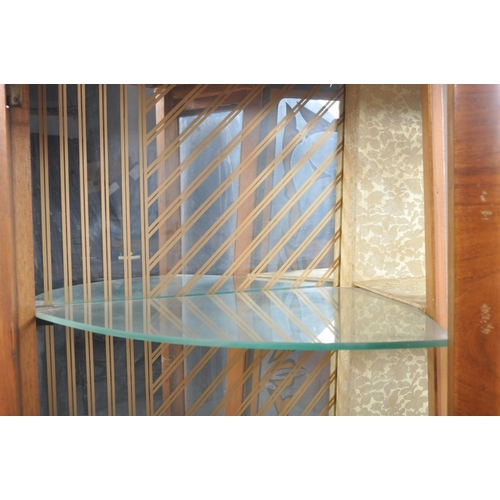 78 - A vintage 20th Century Art Deco walnut breakfront display cabinet vitrine having bowed glass doors t... 