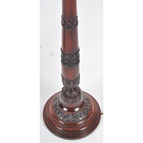 84 - Rochamp Ltd - A matching pair of contemporary carved mahogany table lamp lights having carved stems ... 