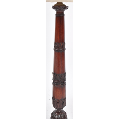 84 - Rochamp Ltd - A matching pair of contemporary carved mahogany table lamp lights having carved stems ... 