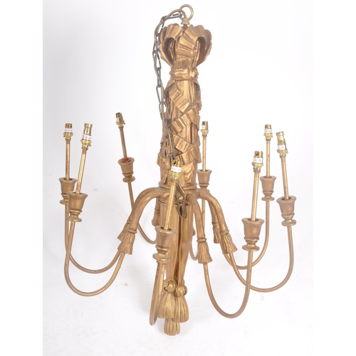 88 - A matching pair of 20th Century gilt wood hanging chandeliers / electrolier. Each having eight branc... 