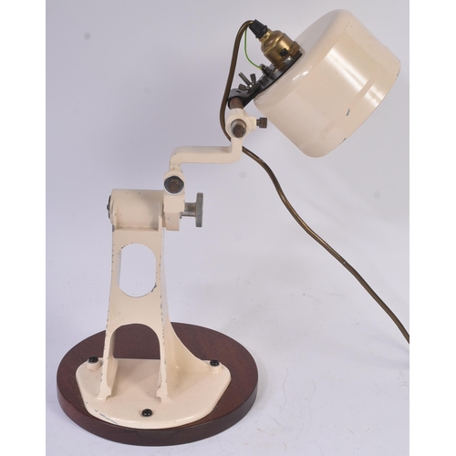 91 - A retro vintage mid 20th Century Industrial desk lamp / work lamp. Cream enamel finish raised on fix... 