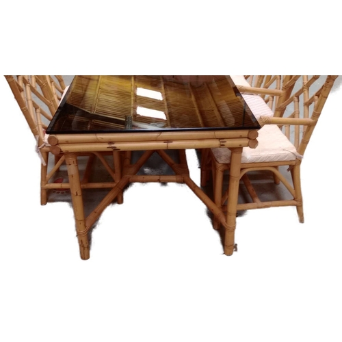 400 - A large 20th Century 1980s bamboo dining table and matching chairs. The table having a tick smokie g... 