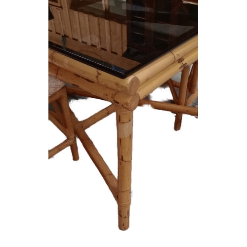 400 - A large 20th Century 1980s bamboo dining table and matching chairs. The table having a tick smokie g... 