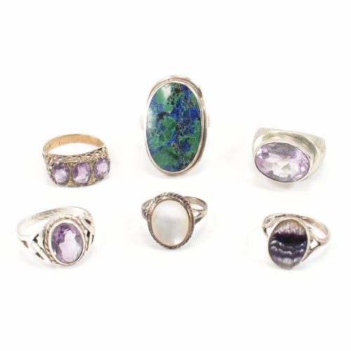 A collection of 925 silver and white metal gem set rings. The rings ...