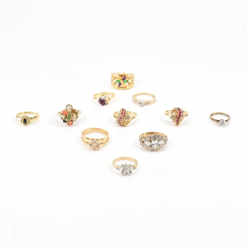 A collection of gem set costume jewellery rings. The rings in gold tone