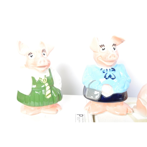 106 - A set of five original Wade made Natwest pigs. Four of the ceramic money boxes within the original p... 