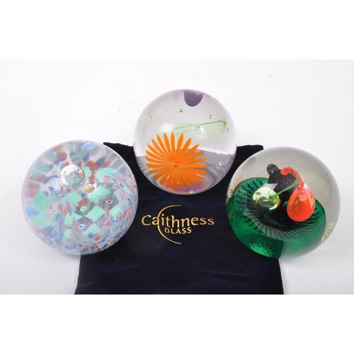 107 - Caithness - Three NOS New Old Stock boxed glass Caithness paperweights to include Playtime, Casino a... 